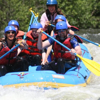 Paddling through the water in a raft in Gunnison
